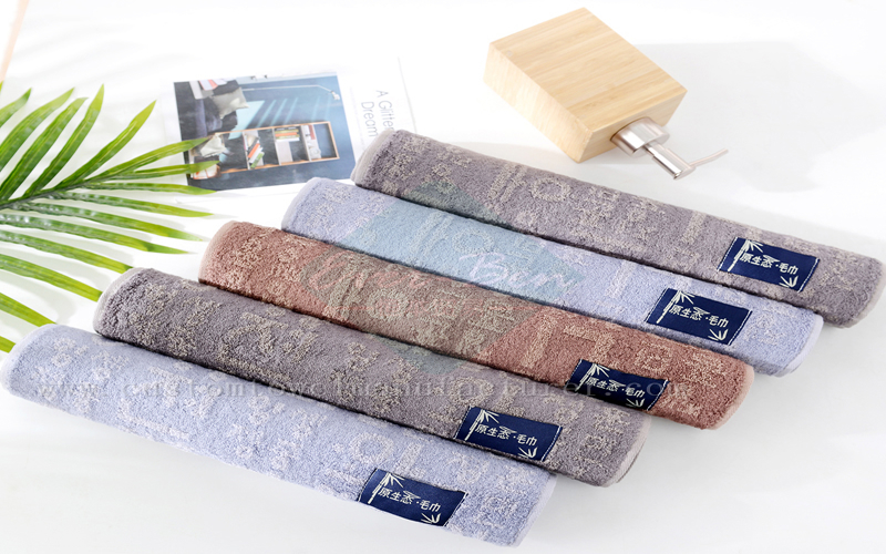 China Custom swimming towel poncho Supplier Bespoke Label Bamboo Yarn Dyed Jacquard Towels Manufacturer